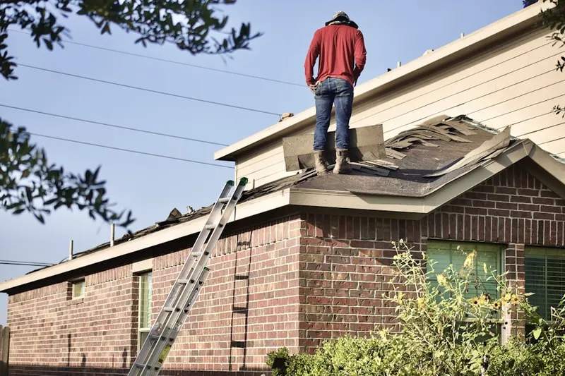 Professional roofer working on a residential roof in Severna Park